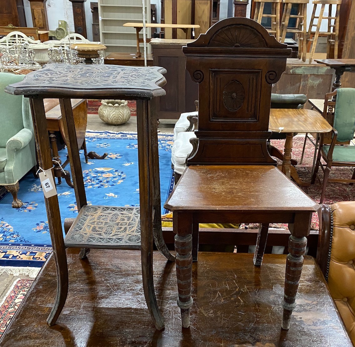 A late Victorian aesthetic movement walnut hall chair, height 88cm together with a chip carved two tier occasional table